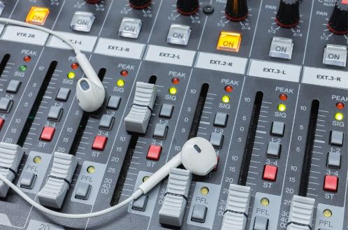 iem headphones lying on a mixer